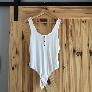 White body suit trio.